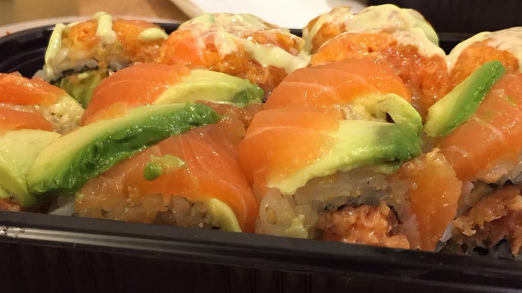 Spicy Orange Roll · Spicy. Salmon and avocado wrapped around spicy tuna and tempura flakes.