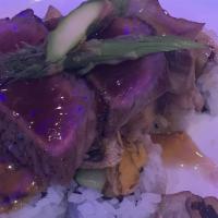 Pop Steak Roll · Premium steak, sweet potato, asparagus, mushrooms, cheddar cheese & onions, topped with teri...