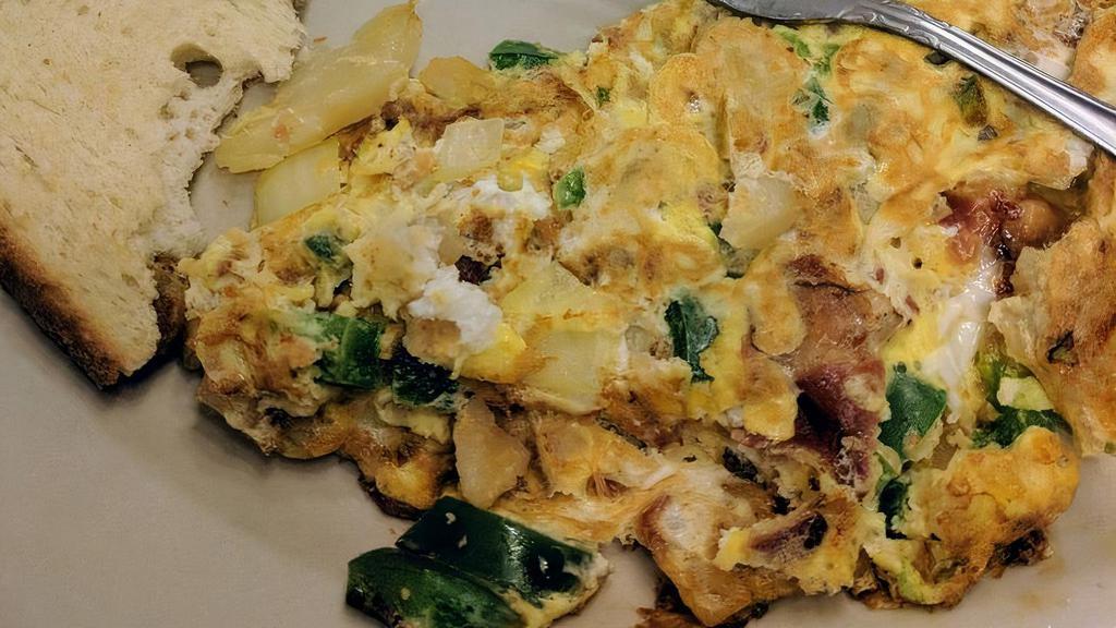 German Omelette · Peppers, onions, bacon and home fried potatoes