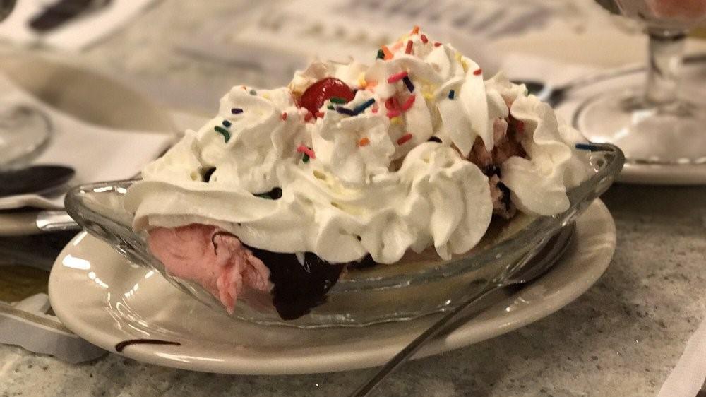 Banana Split · Specialty of the house. Two scoops, topping, banana , whip cream and cherry