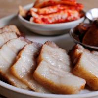 Mini Bossam · Slow-cooked pork belly with homemade bossam Kimchi, pickles & jalapeño soybean paste.