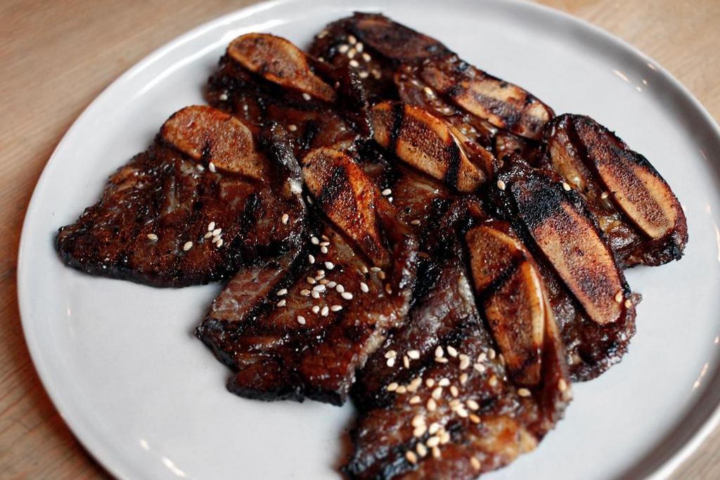 Galbi Bbq · Fire-grilled bone-in beef marinated in chef’s soy sauce