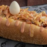 Perro Hotdog · Hotdog, bacon, salad, minced potato chips, mozzarella cheese, and quail egg.
