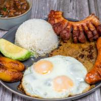 Bandeja Paisa · typical Colombian dish served with grilled steak, pork crackleing, Colombian sausage, fried ...