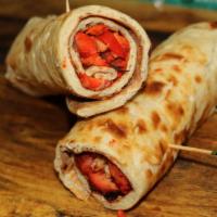 Chicken Tikka Wrap · Chicken tikka cut into pieces and added with marinated onions into a tandoori naan