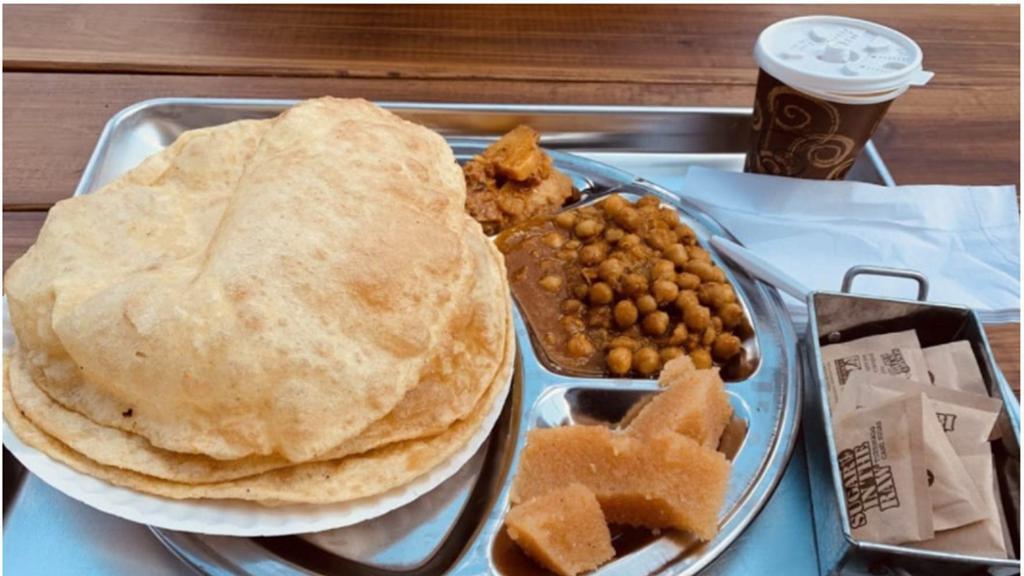 Mughal Nashta  ( Saturday And Sunday Only) · Two puri served with portion of achari Aloo, cholay and halwa