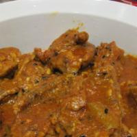 Achari Chicken · Chicken cooked in aromatic herbs and spices