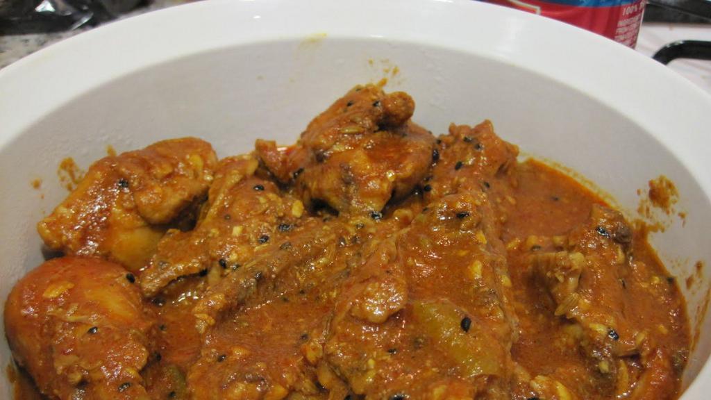 Achari Chicken · Chicken cooked in aromatic herbs and spices