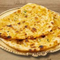 Garlic Naan · Minced Garlic and butter naan baked in clay oven