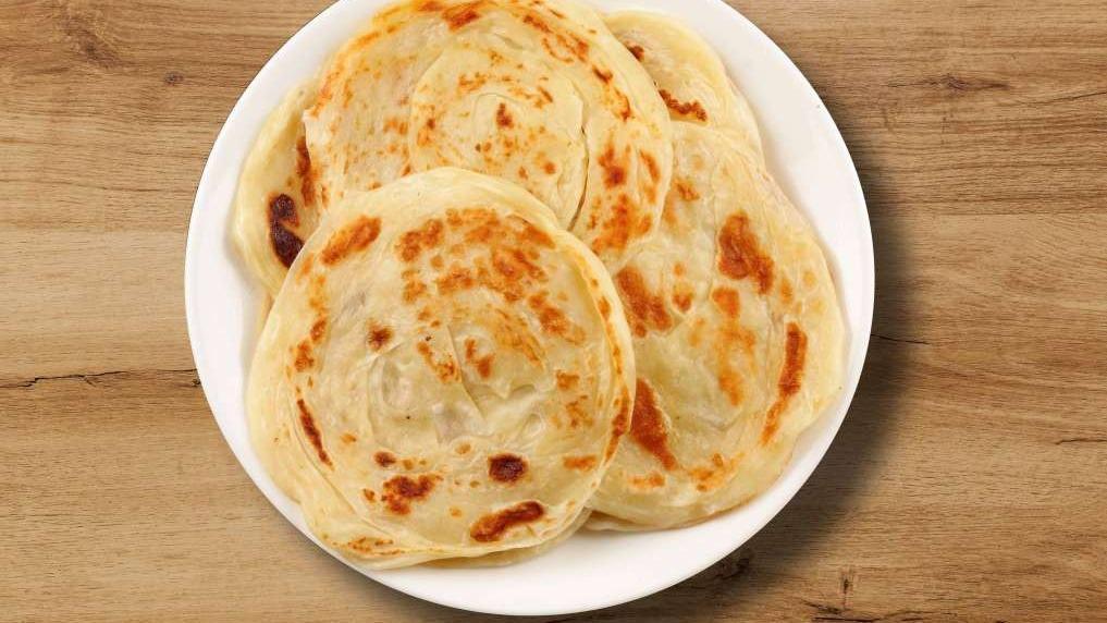 Plain Paratha · Available on weekend. Layerd flatbread with butter filling, cooked on a tawa(pan)