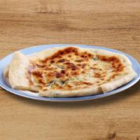 Roghni Naan · Naan garnished with sesame seeds and buttter