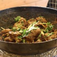 Mozzang Chicken Karahi · Cooked in a heavy cast-iron pan on high flames. The curry is differentiated when masala and ...