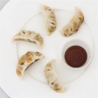 Tb-8. Pan Fried Pork Dumpling · 6 pieces. Juicy pork and chicken dumpling, with spicy and sour soy sauce.
