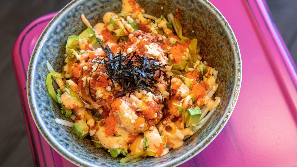 Spicy Tuna Poke · Spicy tuna, shredded cucumber, avocado, oshinko, topped with spicy mayo, eel sauce, tempura flakes, sesame seeds, and tobiko.