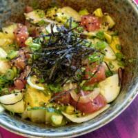 Tuna Poke · Fresh tuna, wakame, scallion, cucumber, onion, avocado, sesame seeds, furikake, and yuzu sau...