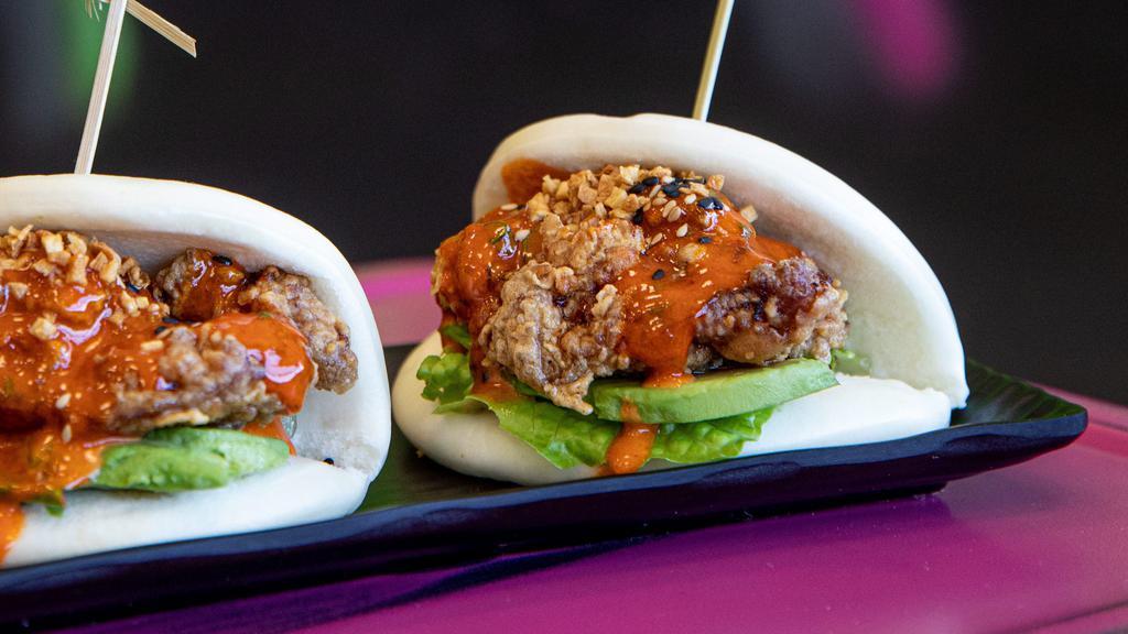 Crispy Chicken Buns · Crispy chicken with lettuce, avocado, and crispy garlic topped with our homemade yuzu kosho sauce.