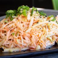 Kani Salad · Kani, nappa cabbage, cucumber, tobiko, spicy mayo topped with scallions, sesame seeds and te...