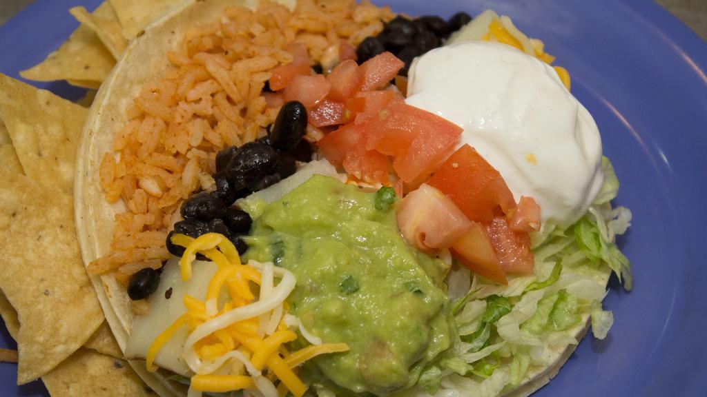 Maui Taco Vegetarian · Choice of beans w/ rice, potatoes, mixed greens, tomatoes & guacamole