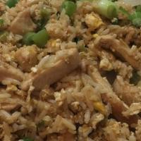 Chaufa De Pollo · Peruvian style fried rice mixed with sauteed chicken, scallions, soy sauce, ginger, spices, ...