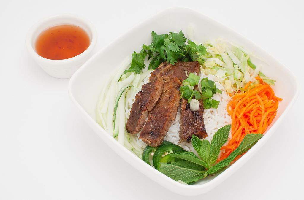 Grilled Pork Chop Vermicelli · Grilled pork chop vermicelli bowl comes with lettuce, beansprout, pickle carrot& radish, cucumber, cilantro, jalapeno and fish / peanut sauce.