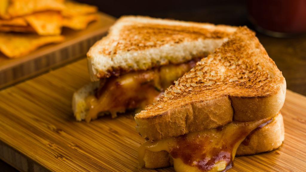 Bbq  Chicken Grilled Cheese & Dorrito Bag · Melted cheddar, mozzarella cheese with bbq breaded chicken, caramelized scallion, between two buttery grilled bread