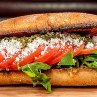 Goat Cheese Sandwich · Vegetarian. Goat cheese, plum tomatoes, homemade pesto, arugula on a toasted ciabatta bread....