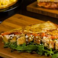 Spicy Chicken Crepe · Chicken curry, goat cheese, tomatoes, honey, greens, chipotle mayonnaise. Spicy.