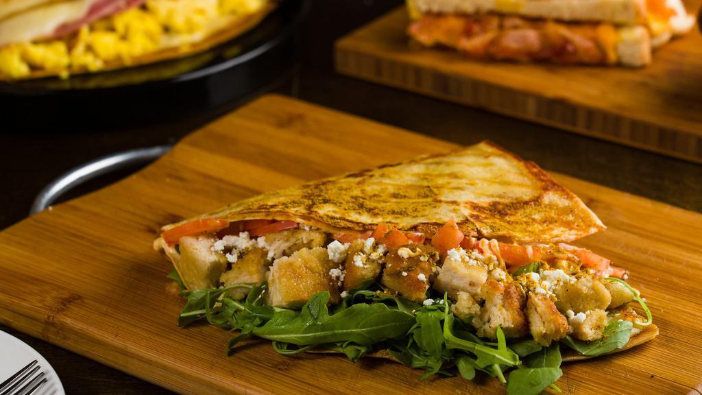 Spicy Chicken Crepe · Chicken curry, goat cheese, tomatoes, honey, greens, chipotle mayonnaise. Spicy.