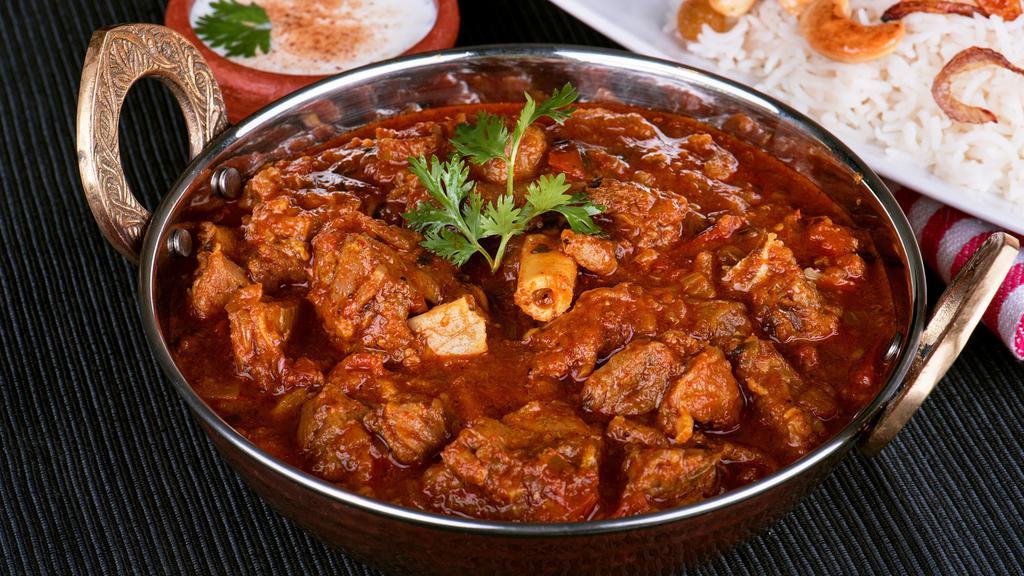 Traditional Lamb Curry · Mutton sautéed in onion tomato curry and flavored with aromatic spices