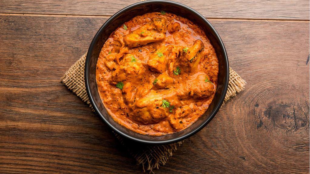 Creamy Butter Chicken Curry · Chunks of grilled chicken cooked in smooth buttery and creamy tomato-based gravy