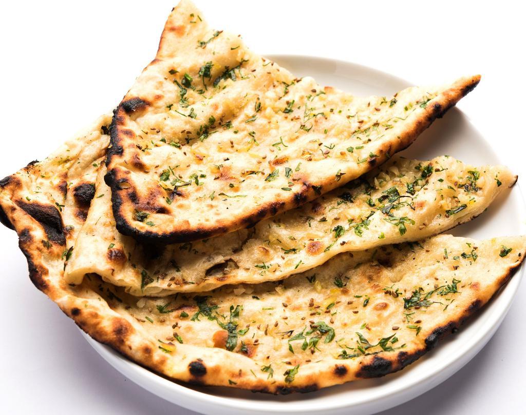Garlic Naan · Flatbread sprinkled with crushed garlic, cheese and baked in tandoor oven