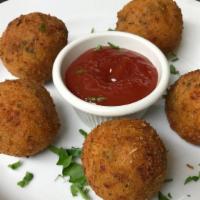 Arancini (5) · Hand rolled rice balls filled with cheese and sweet peas, served with marinara.
