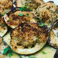 Baked Clams · Whole baked little neck clams.