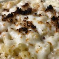 Mac-N-Cheese · White and yellow Cheddar topped with toasted bread crumbs.