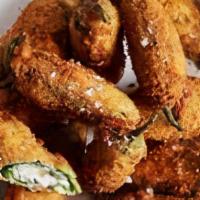 Jalapeno Poppers · Lightly Battered jalapenos stuffed with cheddar cheese