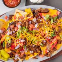 Nachos · Baked tortilla chips topped with chili, or chicken, melted cheddar,
pico de gallo, salsa, & ...