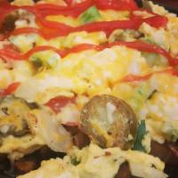 Mexican Scramble · Scrambled eggs with tomatoes, onions, peppers, jalapenos. served over breakfast potatoes wit...