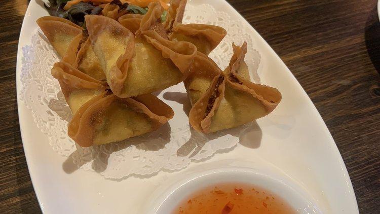 Crab Rangoon (5) · Fried wonton stuffed with crabmeat, cream cheese, green onion served with sweet chili sauce.