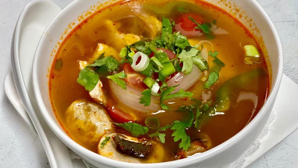 Tom Yum Soup · Choice of shrimp/chicken/veggie spicy and sour soup seasoned with mushrooms, bell peppers, lemongrass and kaffir lime leaves.
