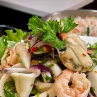 Seafood Salad · Mixed seafood (shrimps, calamari, scallops, mussels), red onions, scallion, cherry tomatoes,...