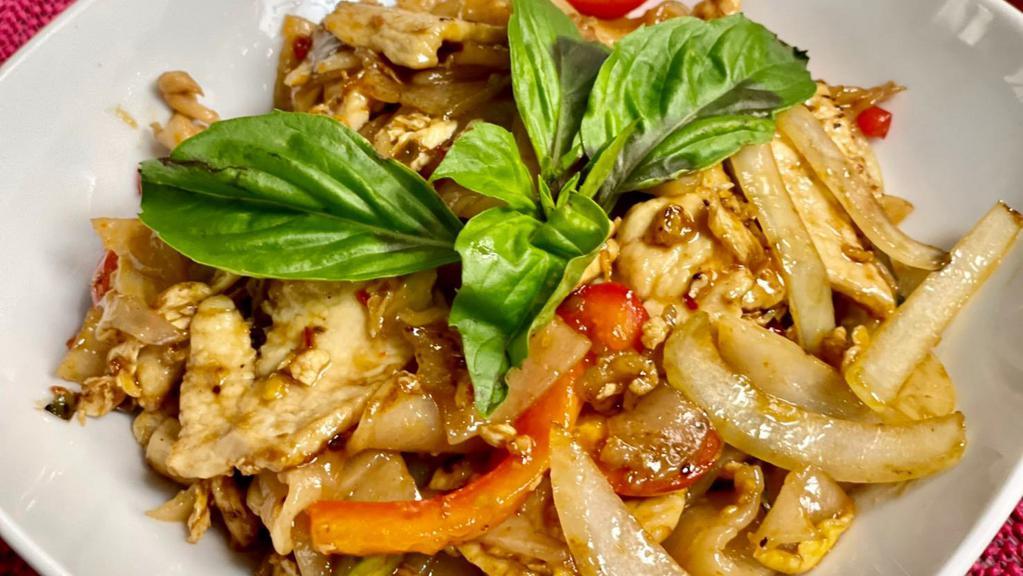 Spicy Drunken Noodles · Stir-fried flat rice noodles with egg, onions, garlic, fresh chili, bell peppers, cherry tomatoes, basil in spicy sauce.