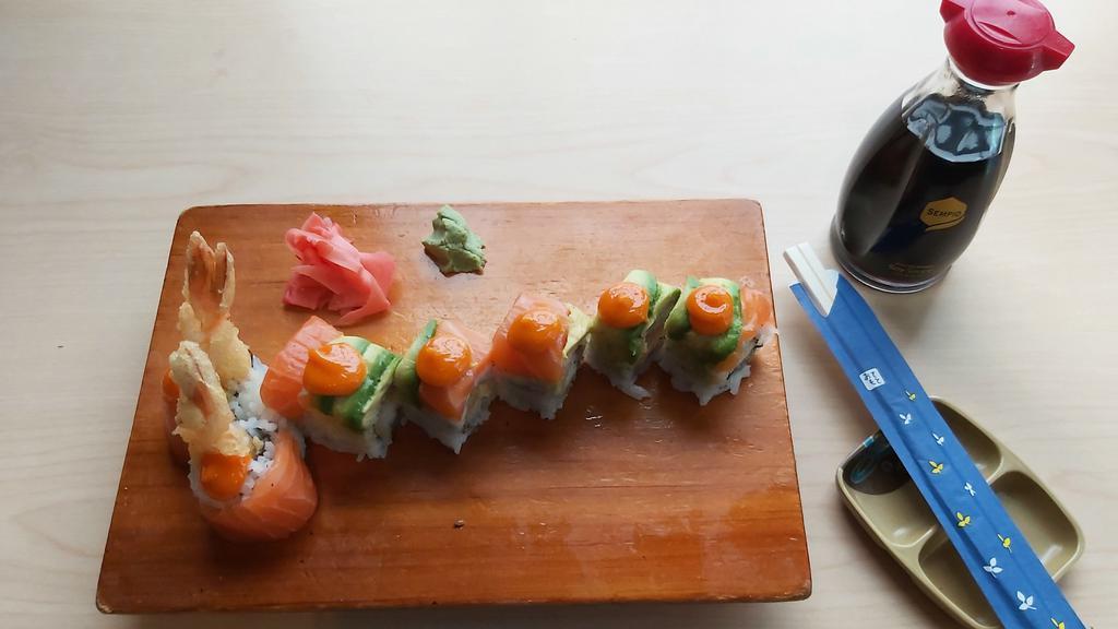 Hanamoto Roll (8) · Avocado, tempura shrimp inside layered with salmon and spicy sauce.