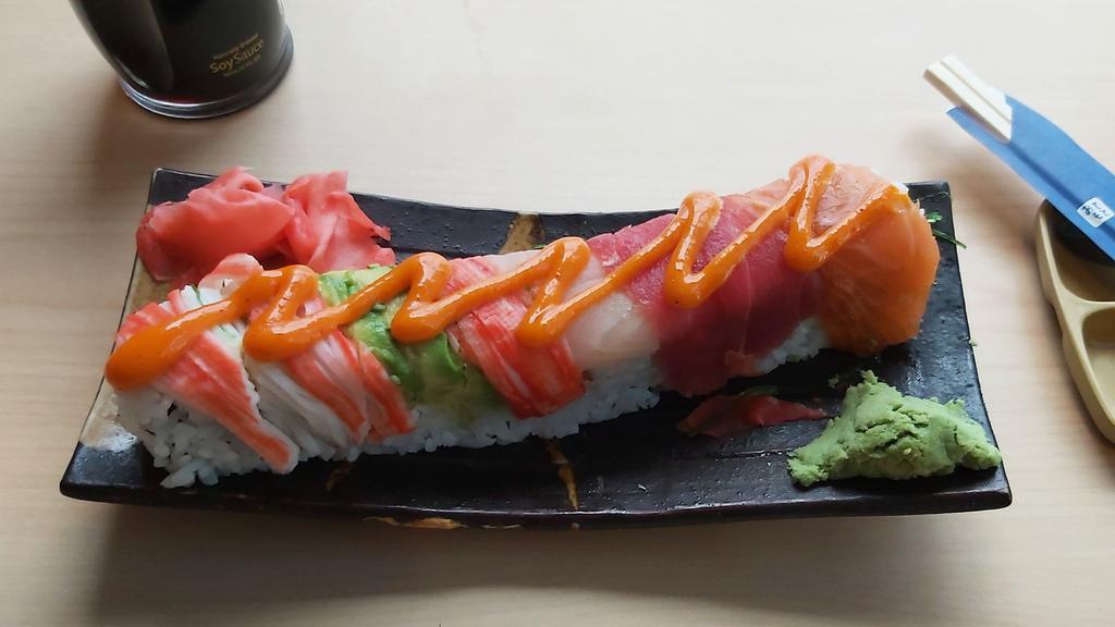 Sr22. Spicy Rainbow Roll (8) · Crunchy spicy crab inside, salmon, tuna, yellowtail on top.