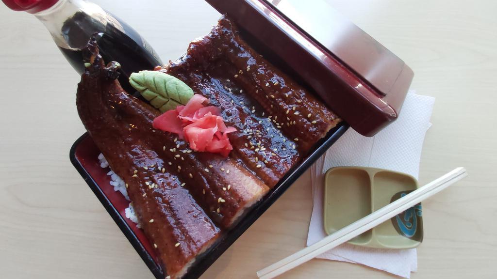 Unagi Don · Broiled eel over rice in a box and topped with eel sauce.