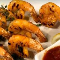 Grilled Shrimp · Grilled shrimp seasoned with Arabic spices with a side of marinara sauce.