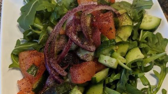 Mixed Green Salad · Mixed green salad consisting of lettuce, tomato, cucumber, arugula and onions.