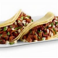 Two Taco Plate · Two, six inch corn or flour tortillas, choice of protein, toppings and side of rice and beans.
