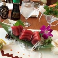 Tuna Or Salmon Don · 12 pieces of tuna or salmon sashimi with sushi rice.