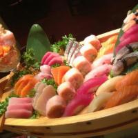 Love Boat · 18 pieces of sushi, 20 pieces of sashimi, dancing eel dragon roll, Christmas tree roll.