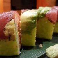 Black Dragon Roll · Inside consists of spicy crab, fresh yellowtail, and masago, topped with sliced avocado and ...